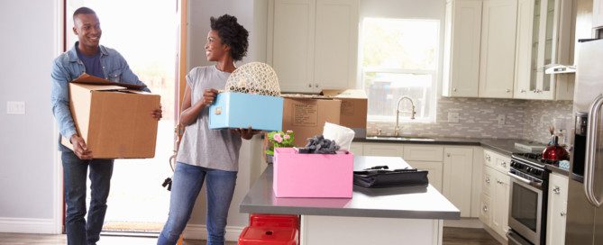 couple packing supplies for the moving company