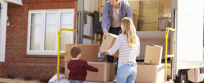 family moving home items with a moving company