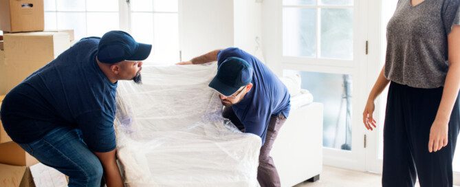 woman supervising professional movers